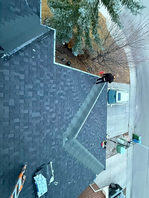 New asphalt shingle roof with hips and valleys complete