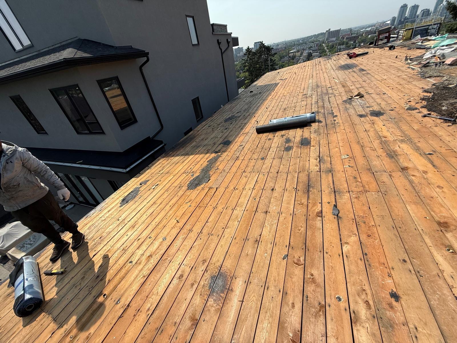 Calgary roof stripped to the original board sheathing during a tear-off